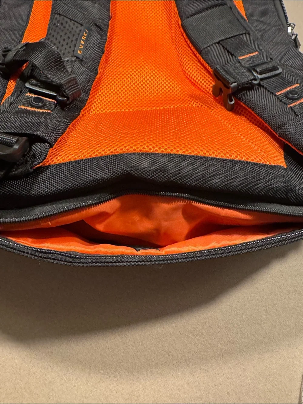 Black Men's Travel Backpack with Orange Accents Everki large laptop bag.